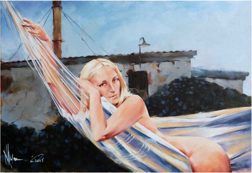Girl swinging in a hammock in nature. Portrait of a naked girl. Blonde outdoors in a hammock.